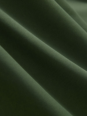 Close-up texture of military green cool print plain button up shirts fabric showing detailed print and weave.