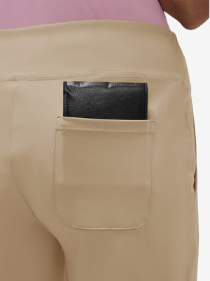 Back view of pocket on light khaki women's high waist stretch golf pants with pockets