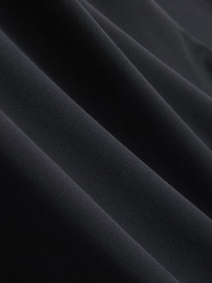 Close-up texture of black cool print plain button up shirts fabric showing detailed print and weave.