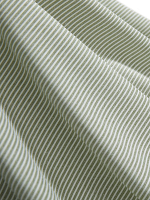 Close-up texture of moss green white comfy breathable pin-stripe texture golf polos fabric showing weave detail.