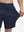 View showing loose fit of navy 4 way stretch breathable workout athletic shorts