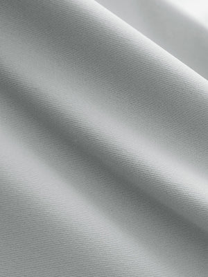 Close-up texture of light grey women's 5 buttons collared polo shirts fabric showing detailed knit weave.
