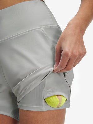 Inside view of pocket on glacier grey women's high waist 2 in 1 quick dry shorts with 7 pockets