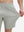 View showing loose fit of silver gray 4 way stretch breathable workout athletic shorts