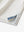 Side slit close-up of Chest Print Polo Shirts in Cream