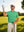 Model on outdoor golf course wearing irland green everyday classic solid polo
