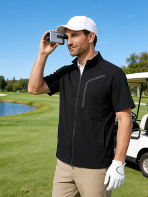 Front upper body angled shot of model wearing black lightweight UPF50+ short sleeve golf vest jacket and using a golf rangefinder on the golf course