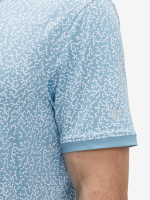 Detail view of cuff on white blue abstract stylish full print contrast collared golf polo shirts